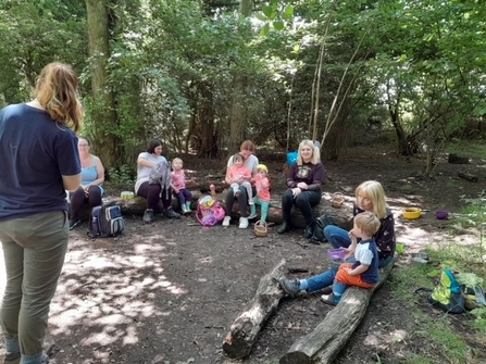Charlotte leading a forest activity with a nursery group.