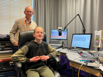Youth board member sat in the radio studio with host