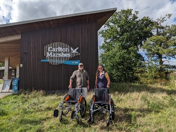 Kevin and Angela with offroad wheelchairs at Carlton Marshes Nature Reserve September 2025 