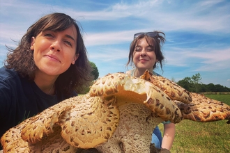 Lucy and Katherine, standing behind a large fungus - dryad's saddle