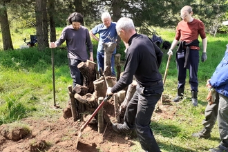 Trimley Marshes volunteers building a stag beetle pyramid - Joe Underwood 