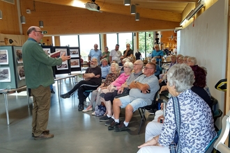 Poetry being read by Dean Parkin for attendees of the Marshland Histories launch