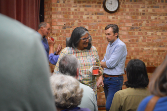 People talking in a crowd at an event