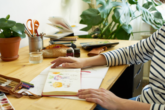 A view of a desk with sketching materials 