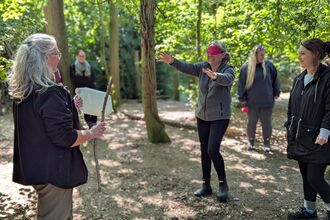 adults playing games in the wood