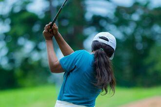 Person playing golf 