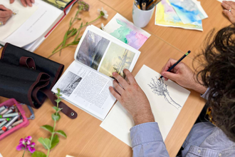 An top-down view of someone drawing 