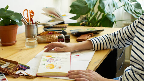A view of a desk with sketching materials 