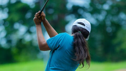 Person playing golf 