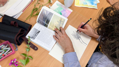 An top-down view of someone drawing 