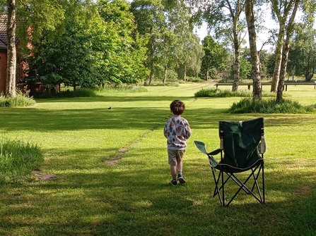 Logan, Shaun's son, watching a blackbird on their camping trip.