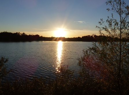 sunset over the sailing lake at Lackford Lakes