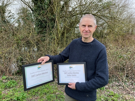 Steve Aylward with awards for Carlton Marshes