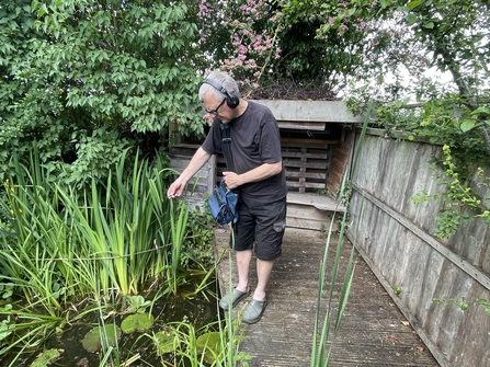 Mike using a hydrophone in a pond