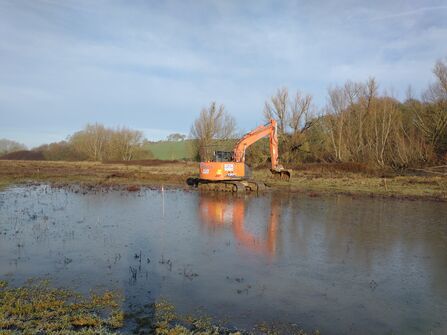 Digger creating scrapes 