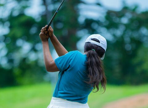Person playing golf 